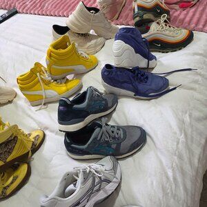 Assorted womens athletic and fashion shoes.